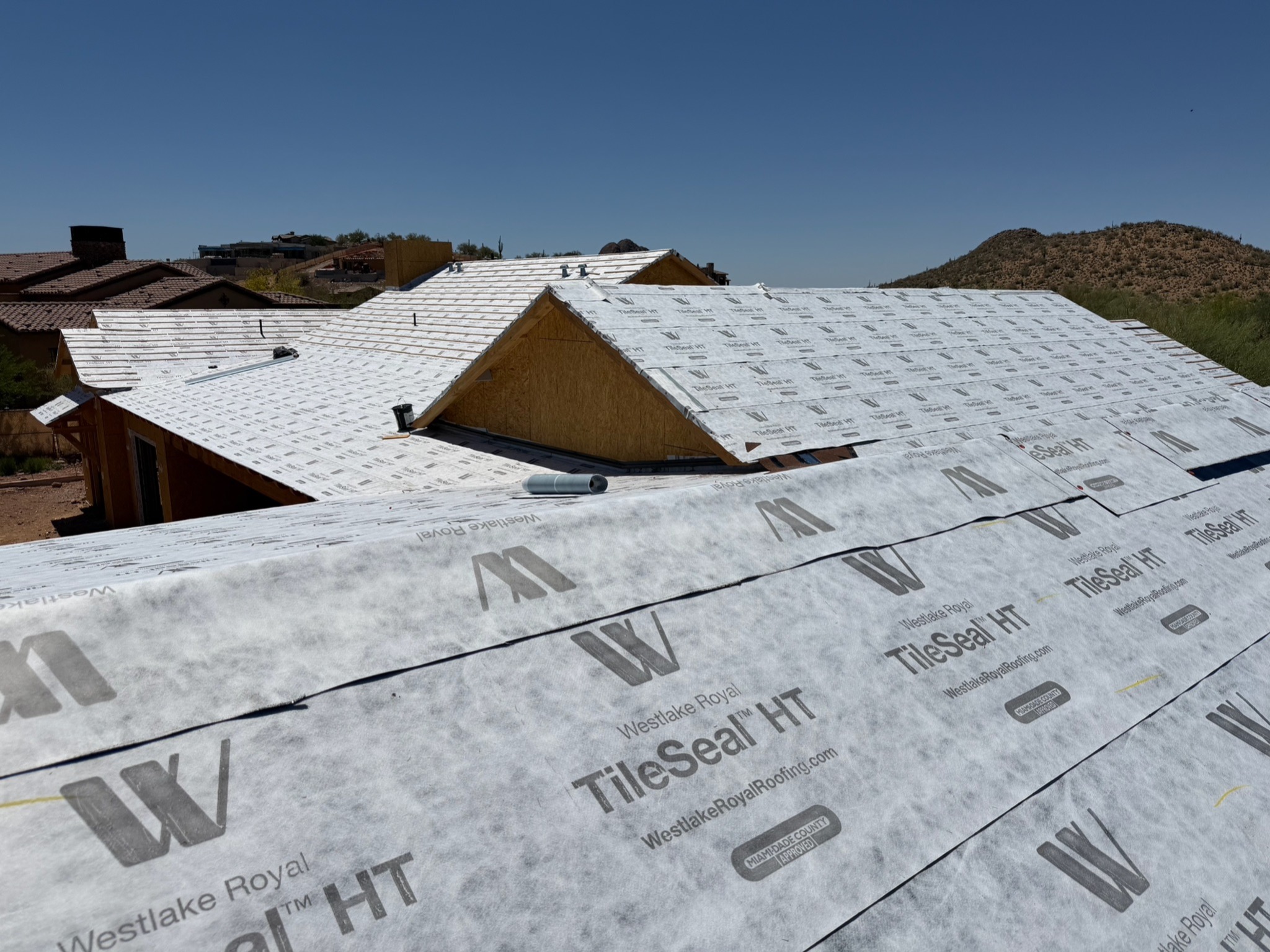 Completed custom Arizona home with dark tile roof