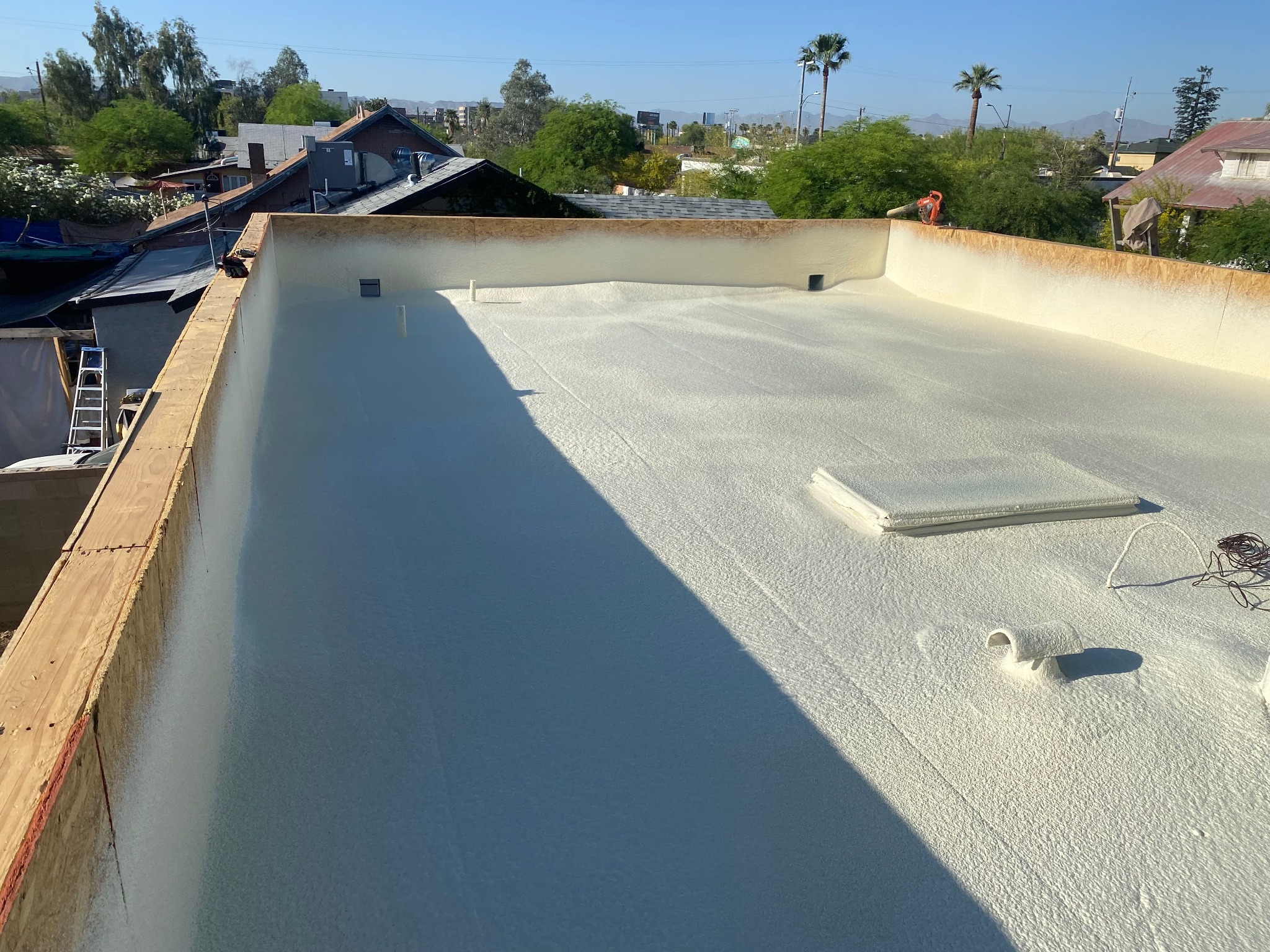 Spray polyurethane foam roof installation