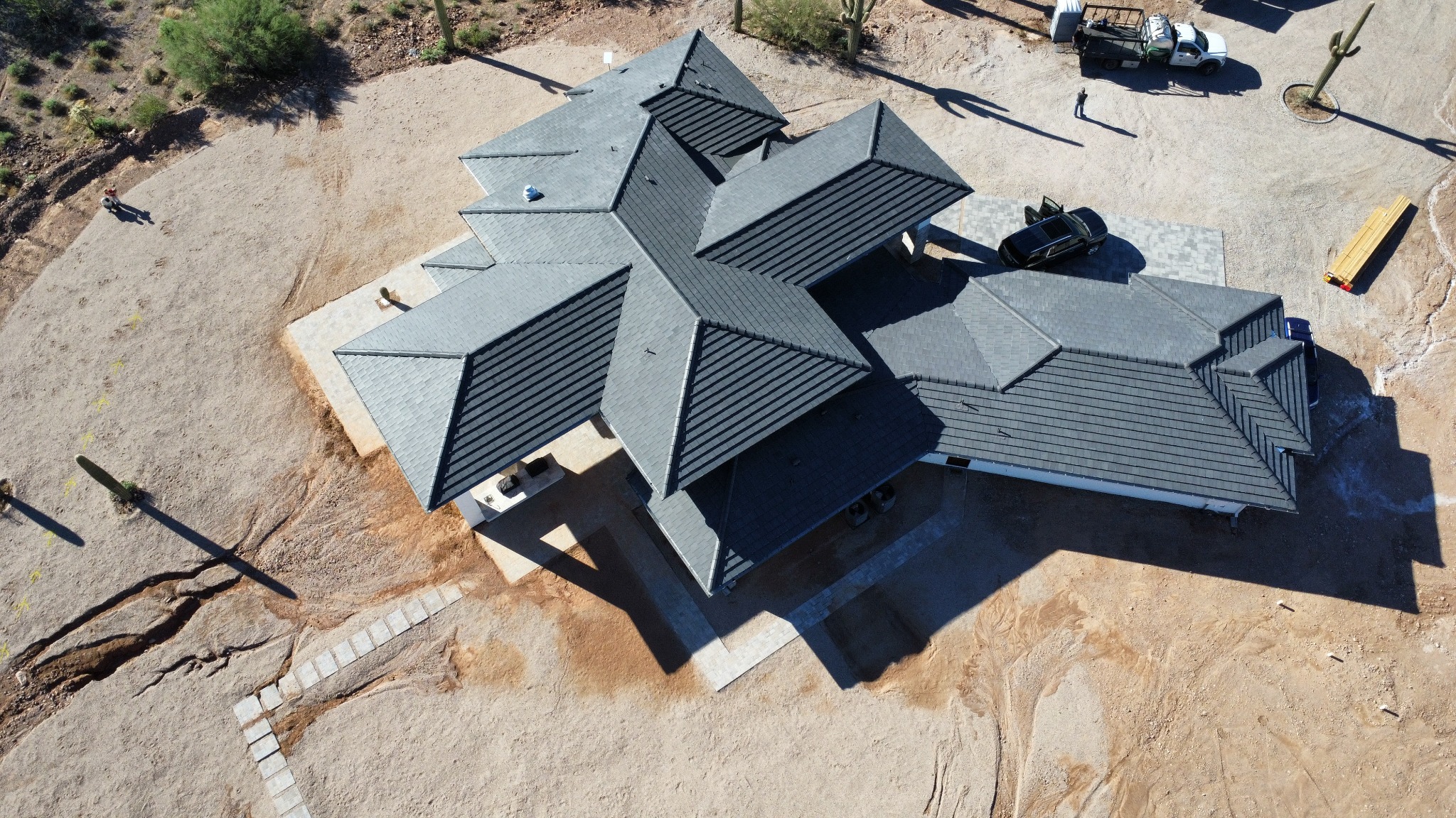 Custom Arizona home with mixed shingle and standing seam metal roofing