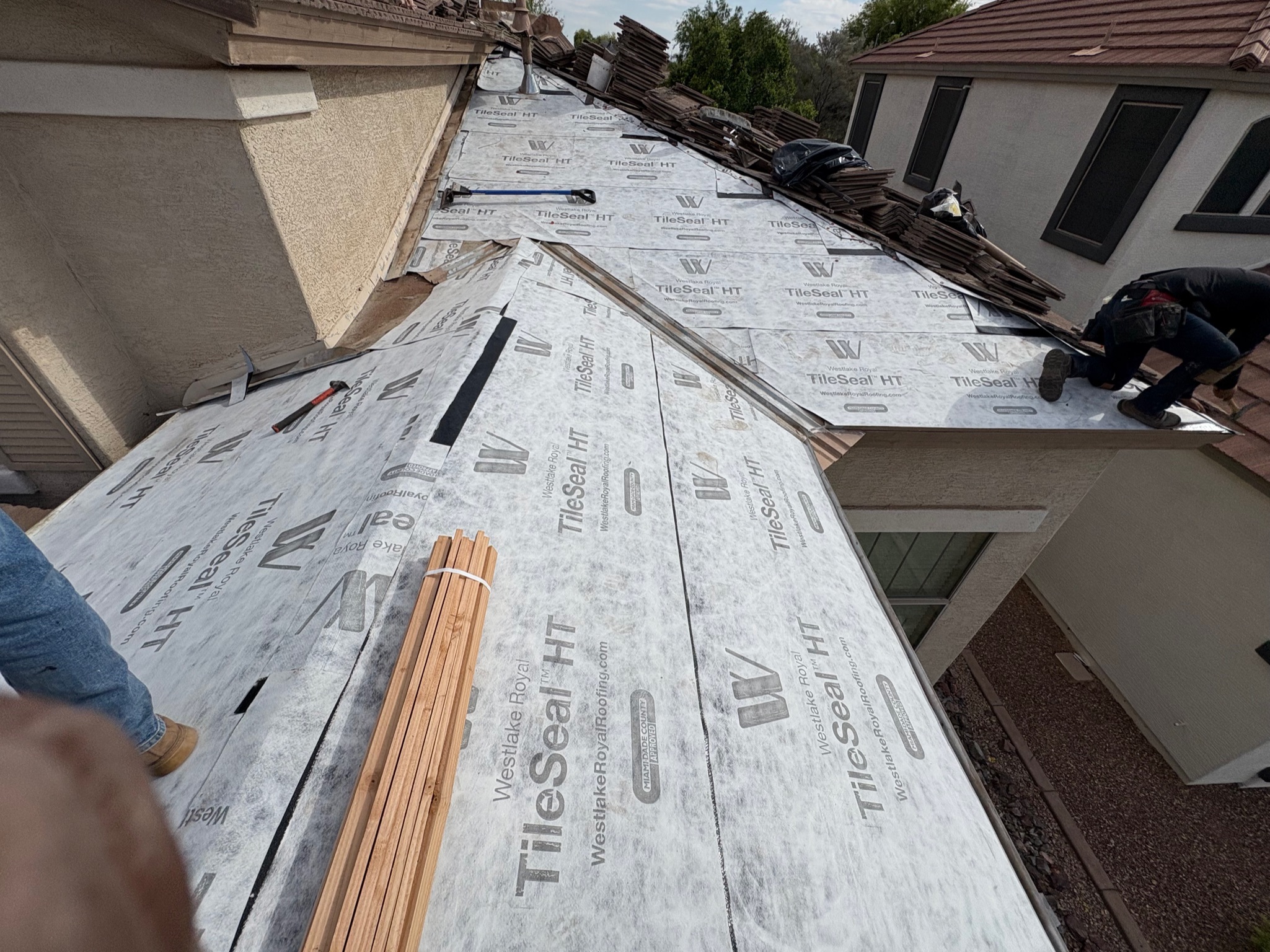 Tile roofing installation in progress